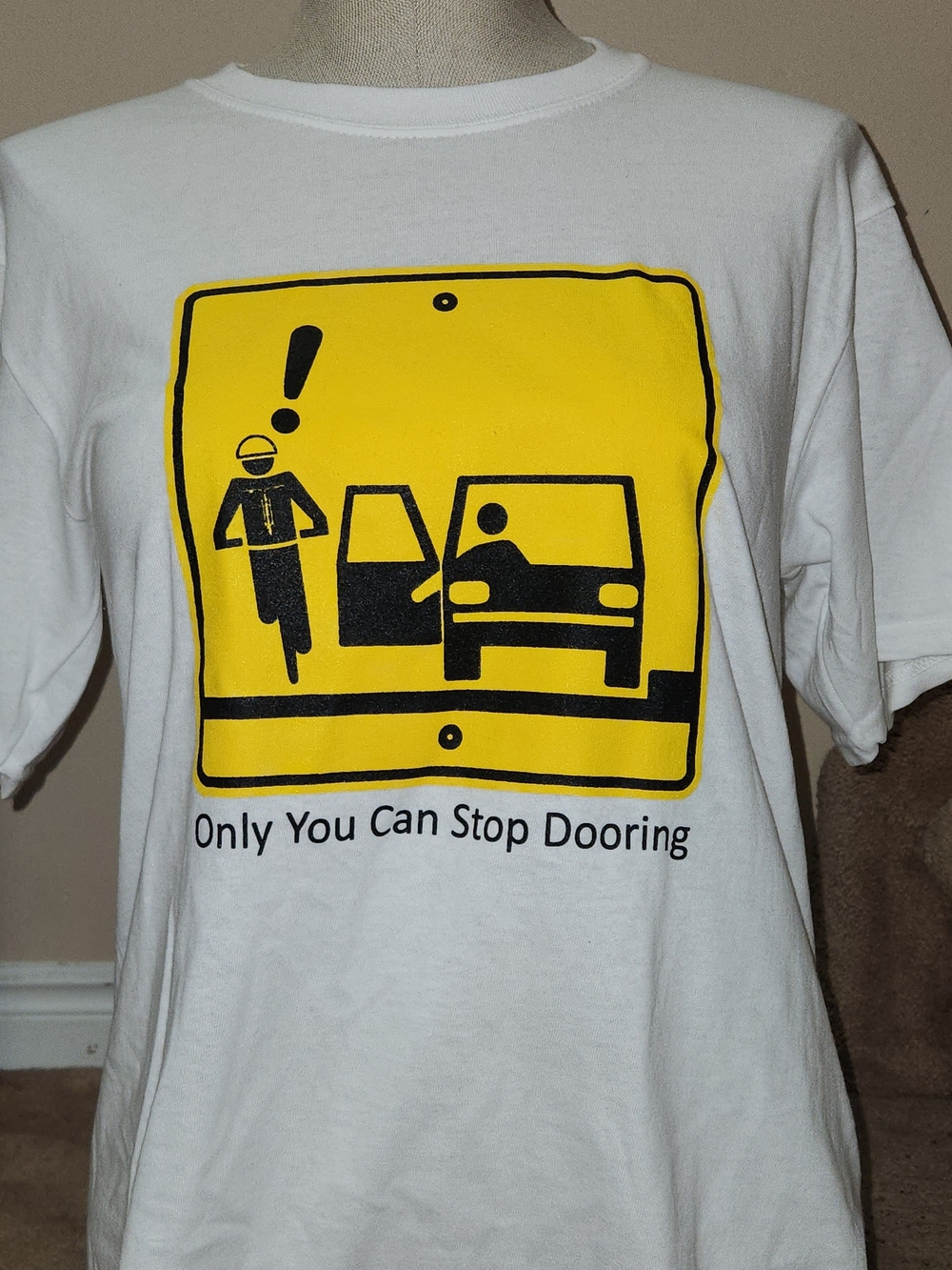 White Graphic Tee with Yellow Safety Sign and Black Illustrations